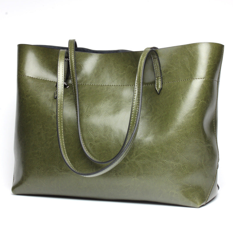 New fashion leather handbag shoulder cowhide shopping bag leather bag is simple and practical, portable