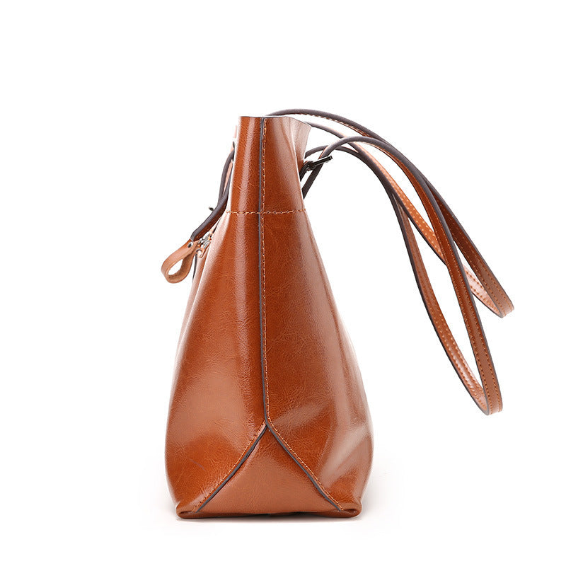 New fashion leather handbag shoulder cowhide shopping bag leather bag is simple and practical, portable
