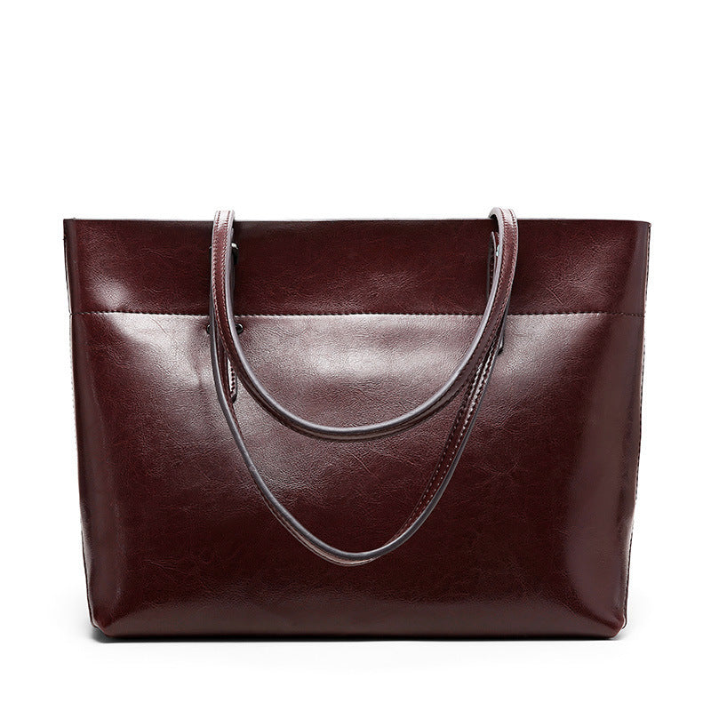 New fashion leather handbag shoulder cowhide shopping bag leather bag is simple and practical, portable