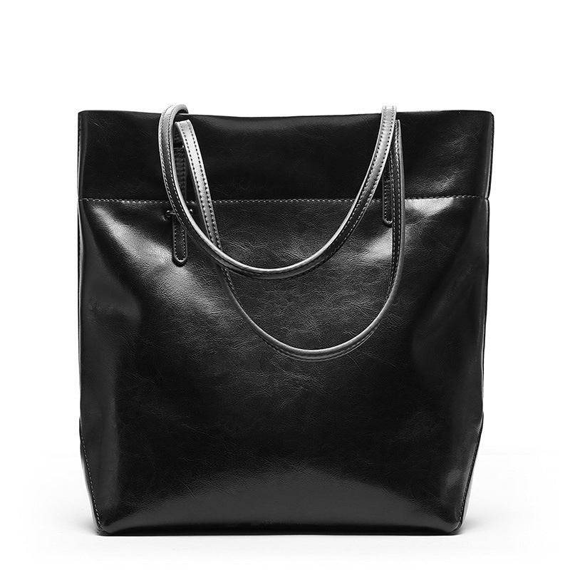 New fashion leather handbag shoulder cowhide shopping bag leather bag is simple and practical, portable