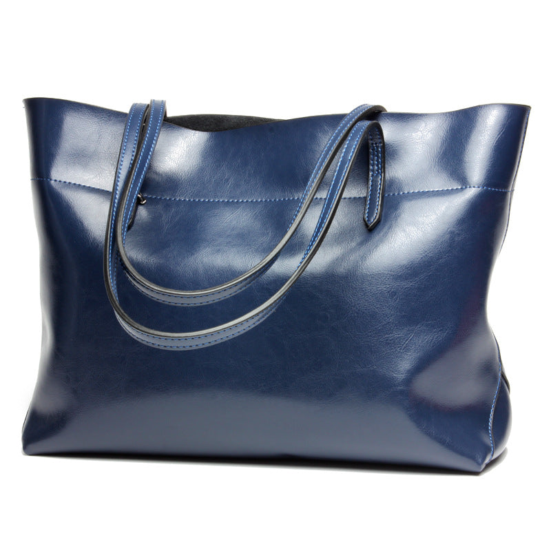 New fashion leather handbag shoulder cowhide shopping bag leather bag is simple and practical, portable