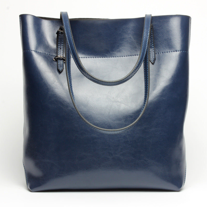 New fashion leather handbag shoulder cowhide shopping bag leather bag is simple and practical, portable
